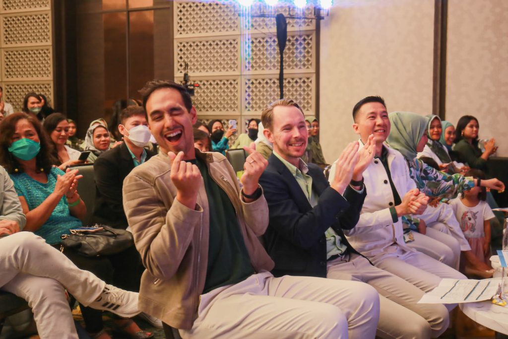 Corporate gala audience cheering — Oriflame Mega Explor event coverage