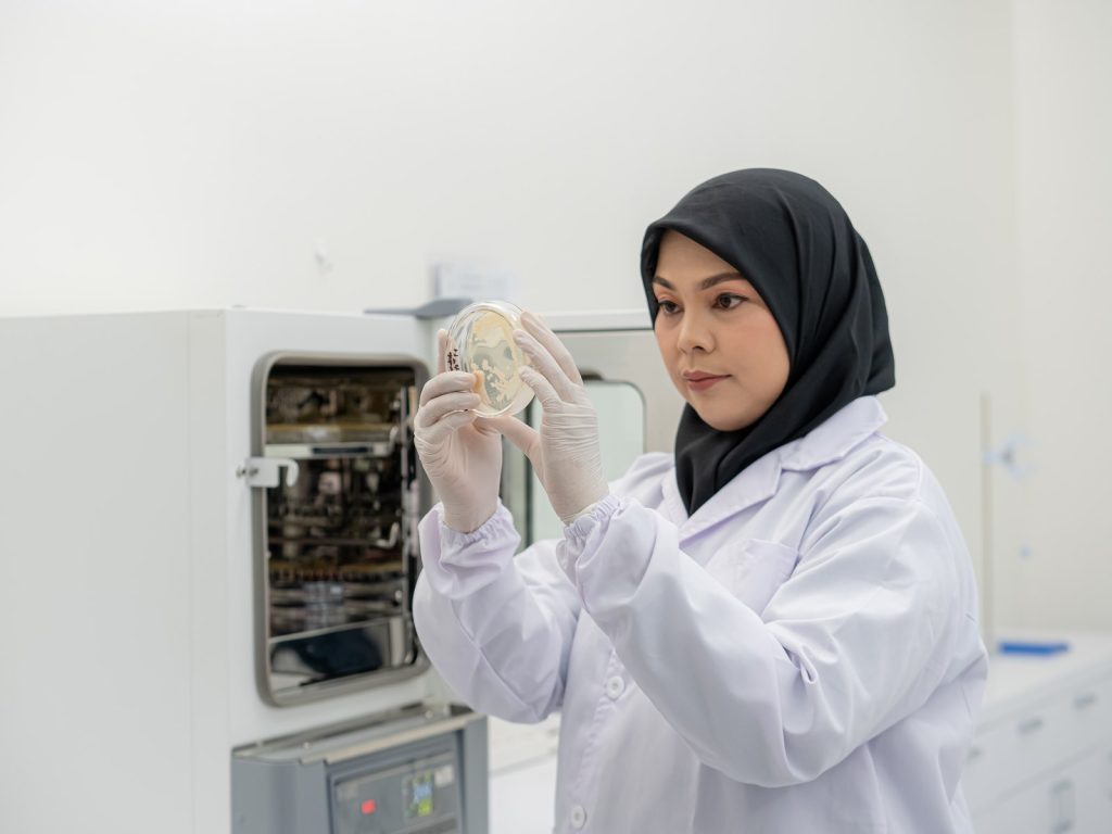 A lab analyst checking a sample — Company Profile, PT Dwi Jaya Cosmedika